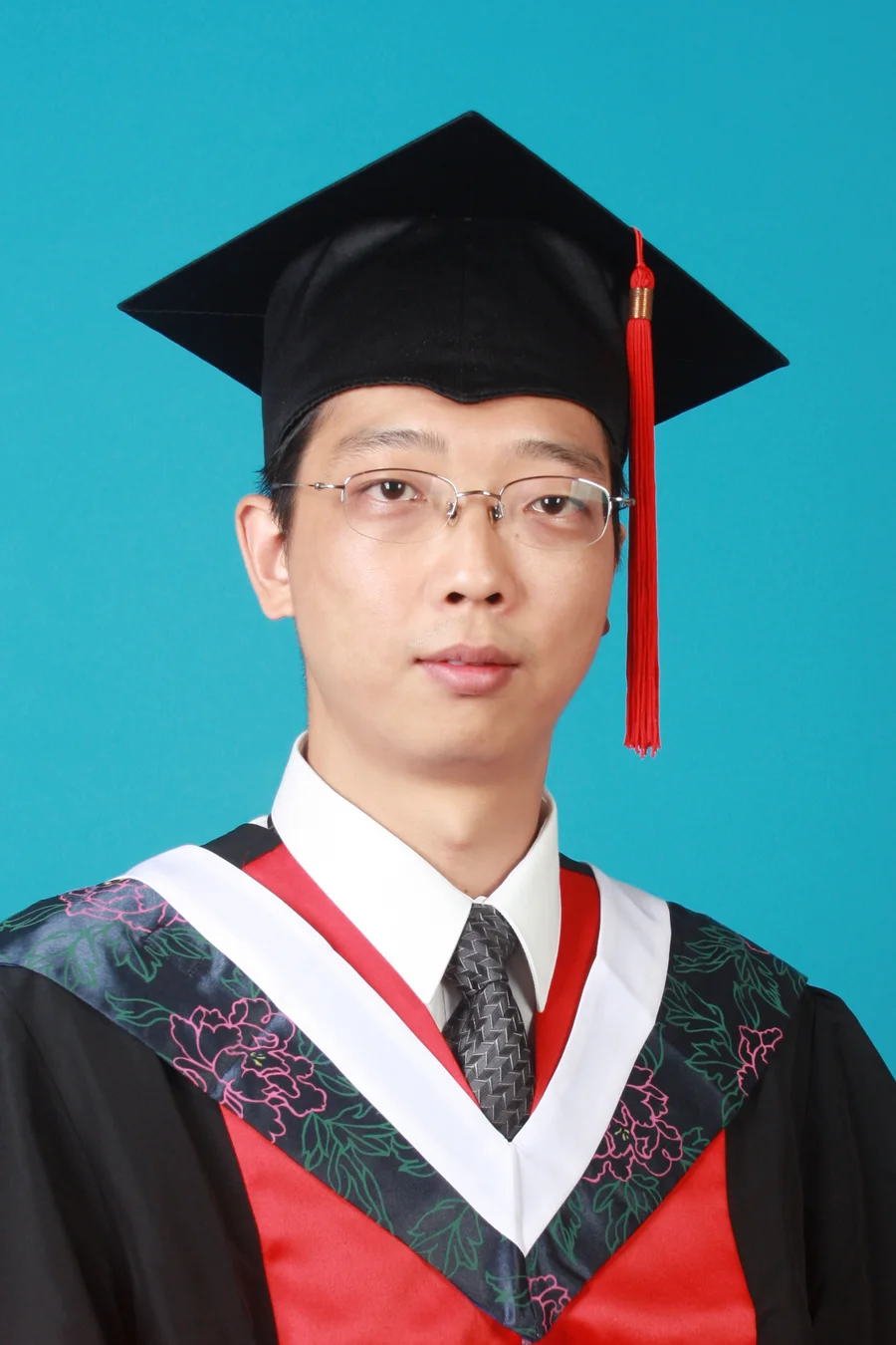 Dr. Yao in doctoral graduation dress, Beijing University of Chinese Medicine, 2009